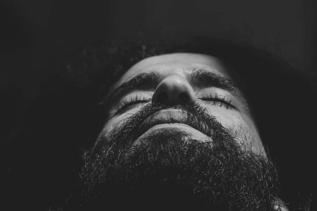 black and white photo of man with beard